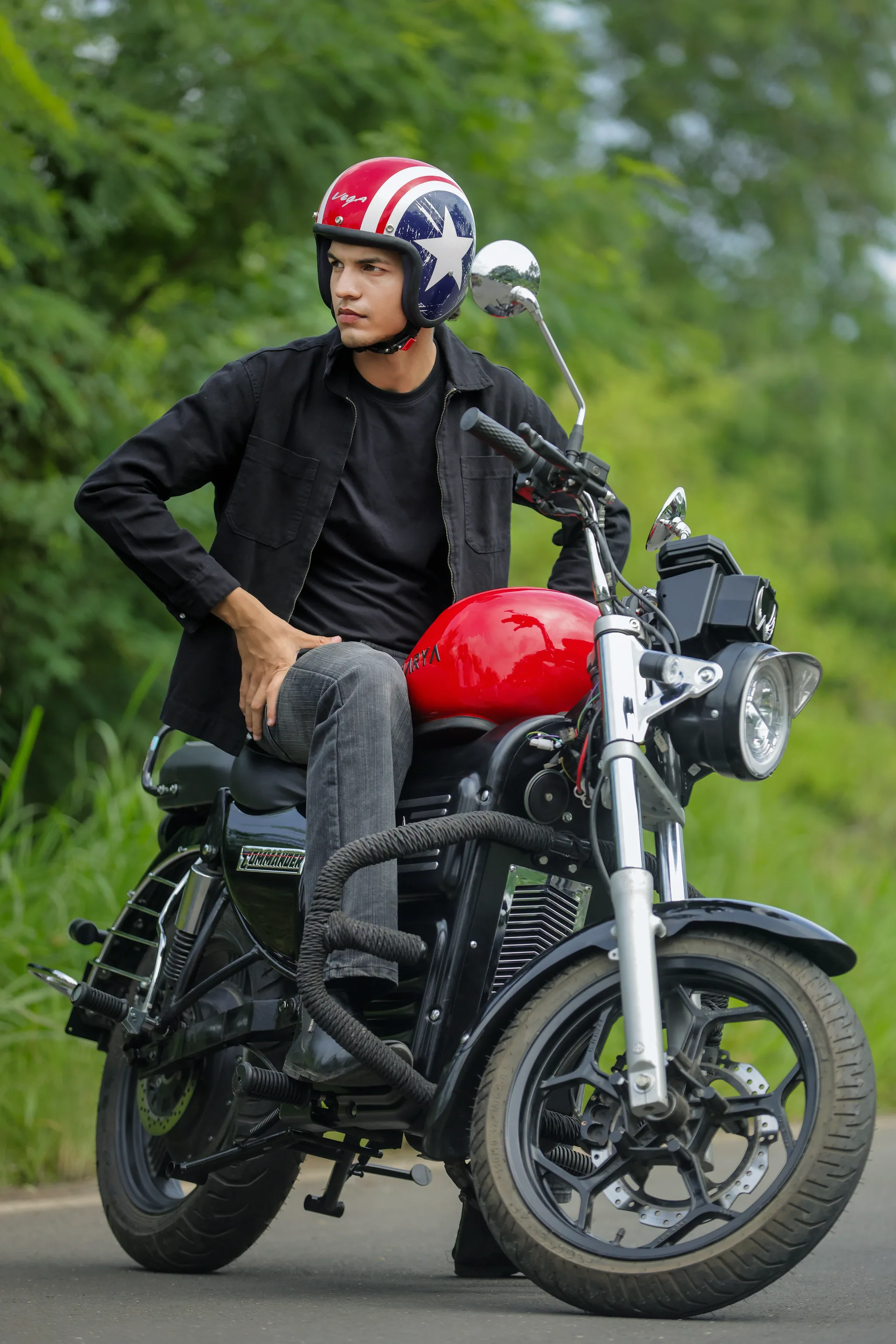 A rider on the Aarya Commander electric motorcycle